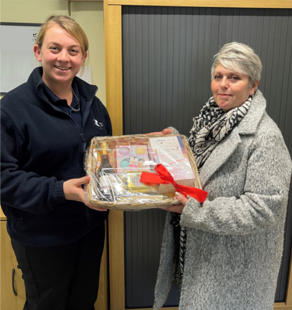 Team member Jo receives a thank you hamper for all her hard work